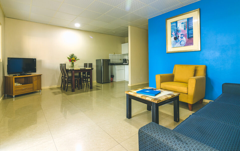 Spacious living room inside apartment at Aruba Blue Village